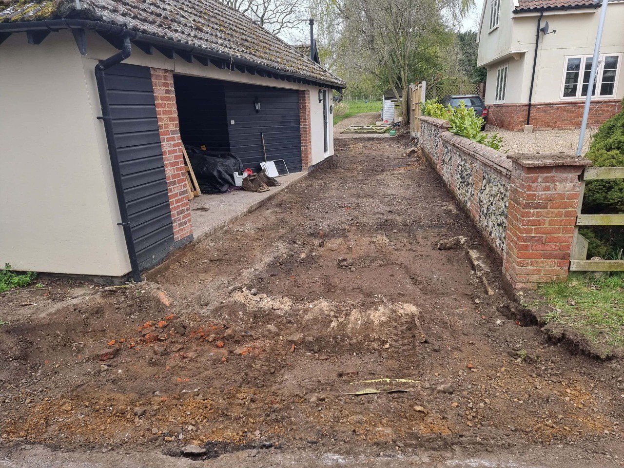 This is a tarmac driveway that is in the process of being dug out and installed by NS Driveways Witley